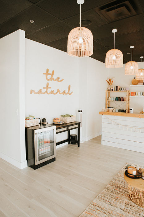 Interior of The Natural, with rattan pendant lights and white walls
