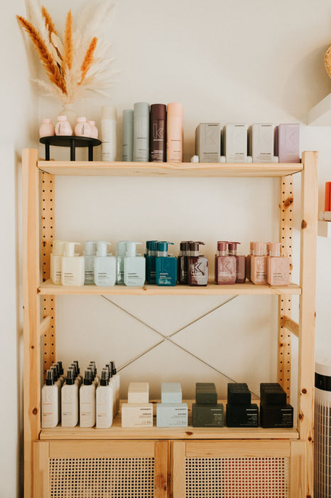 Kevin Murphy retail products displayed on pine shelves at The Natural